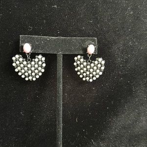 Black heart pierced earrings with white/pink accents, perfect for any occasion